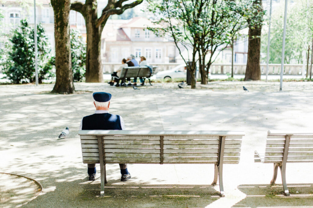 Man sitting on a bench in a park