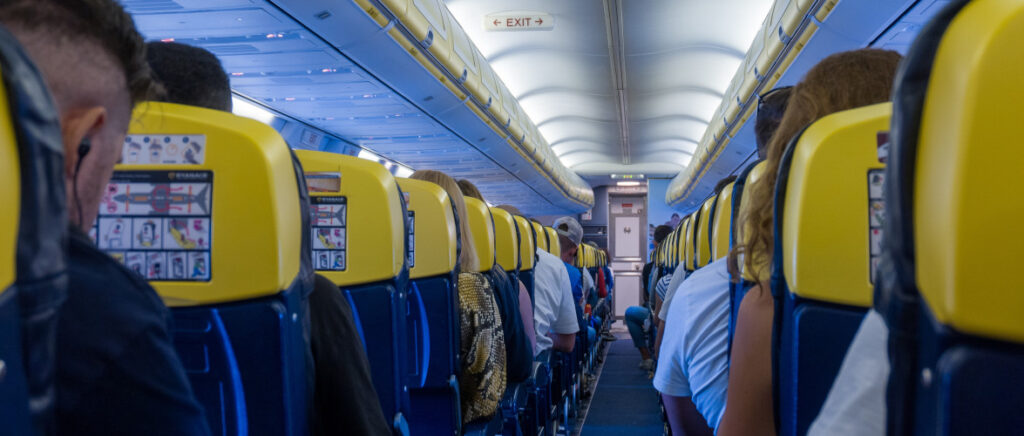 Passengers sitting in their seats on a Ryanair plane