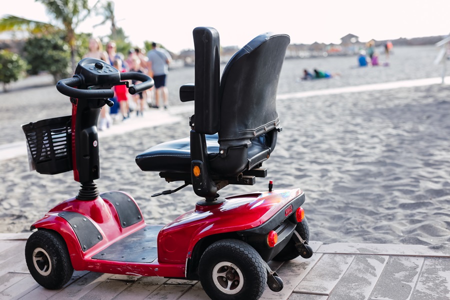 Reb mobility scooter parked on a cobbled road