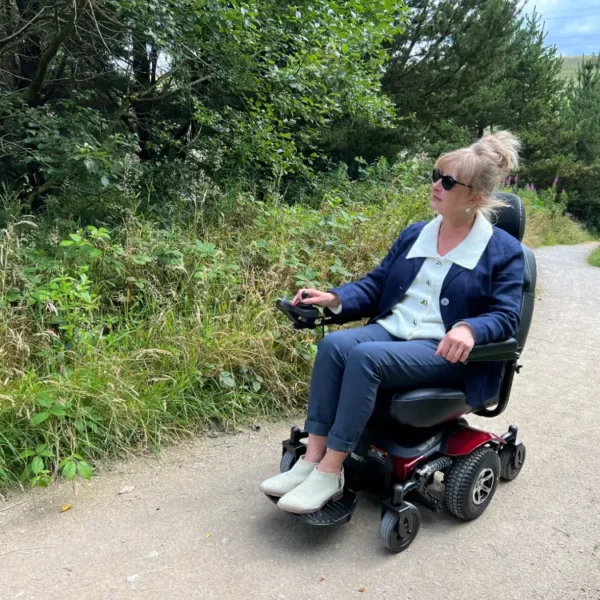 Woman riding Vision Pro along woodland path